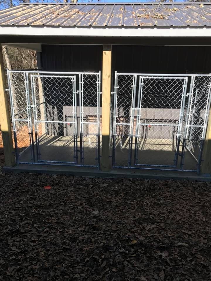 Heavy-duty chain-link dog kennel built by Gadsden Fence LLC